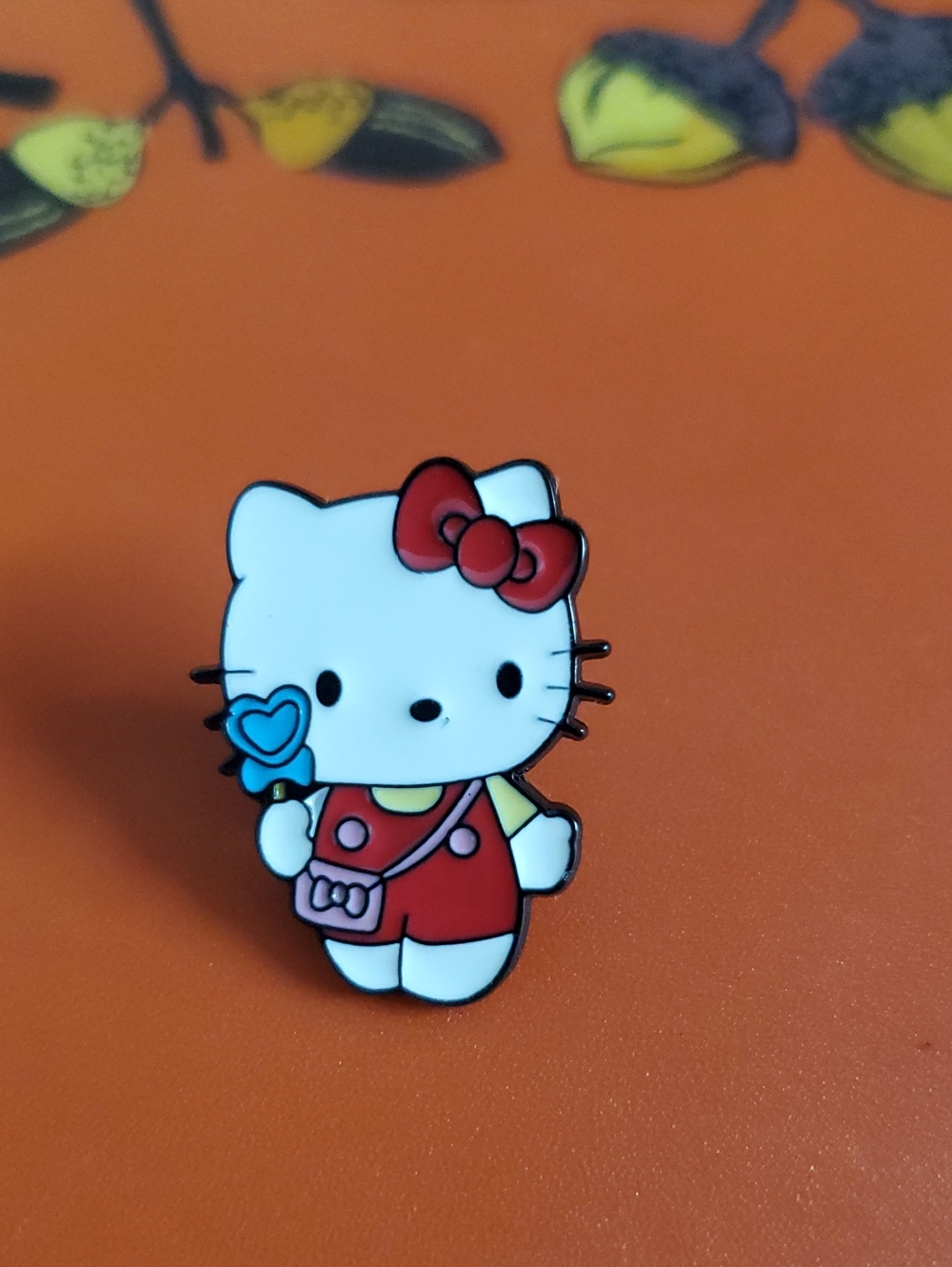 Sanrio Hello Kitty Red Outfit Enamel Pin with Blue Heart